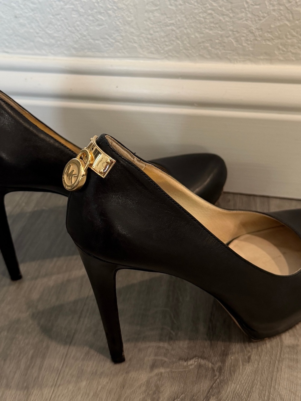 Michael Kors Black Leather Stiletto Pumps with Gold Logo Charm
